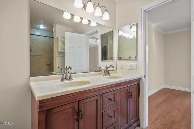 a bathroom with a sink double vanity and a mirror