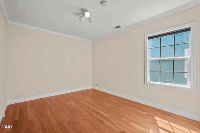 a view of an empty room with a window
