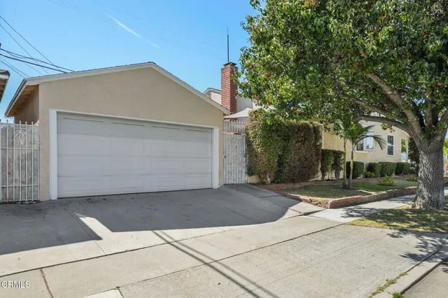 a front view of a house with garage