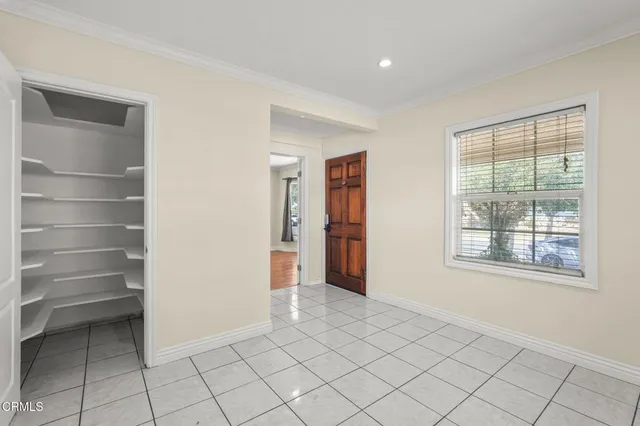 a view of an empty room with a window