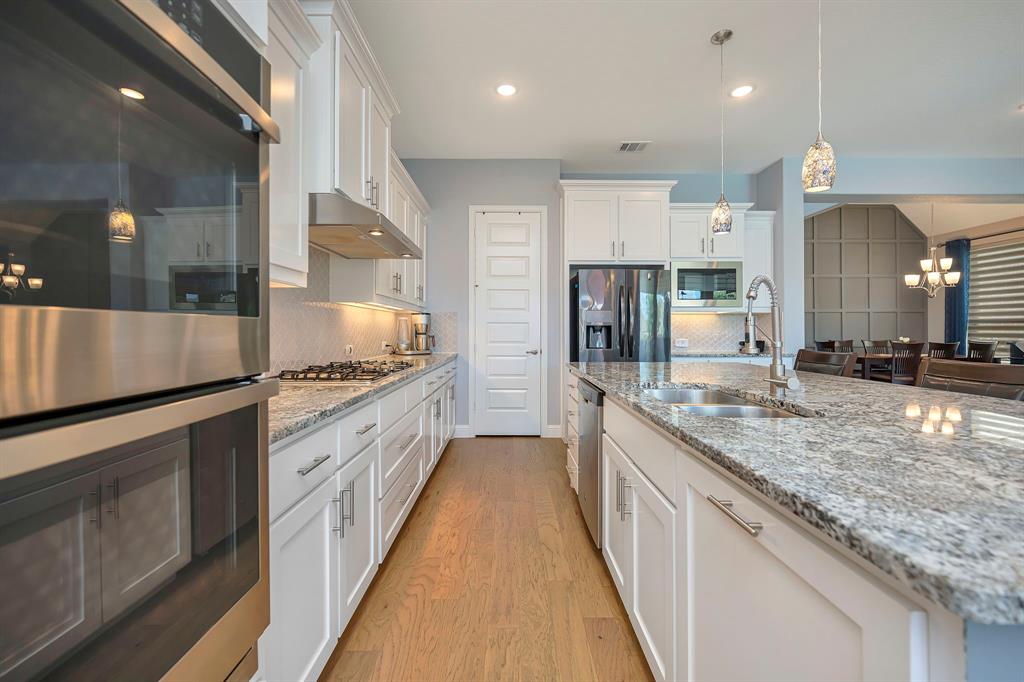 11305 Misty Ridge Drive Flower Mound, TX 76262 - Photo 14 of 40 Gas cooktop in the kitchen.