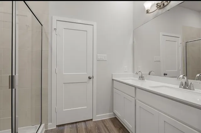 a bathroom with a sink and mirror