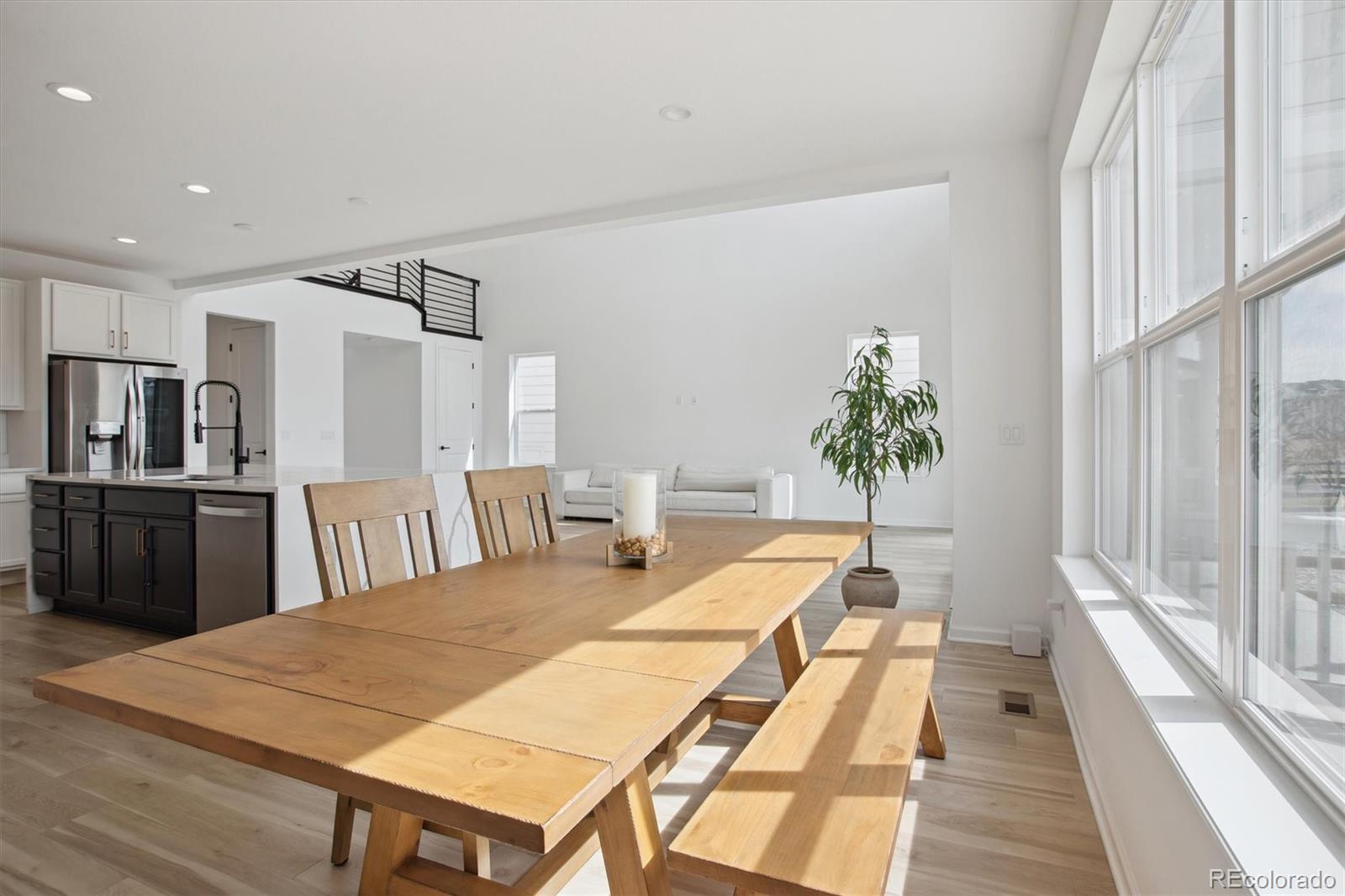 741 Simmental Loop Castle Rock, CO 80104 - Photo 14 of 50 a living room with furniture a large window and wooden floor