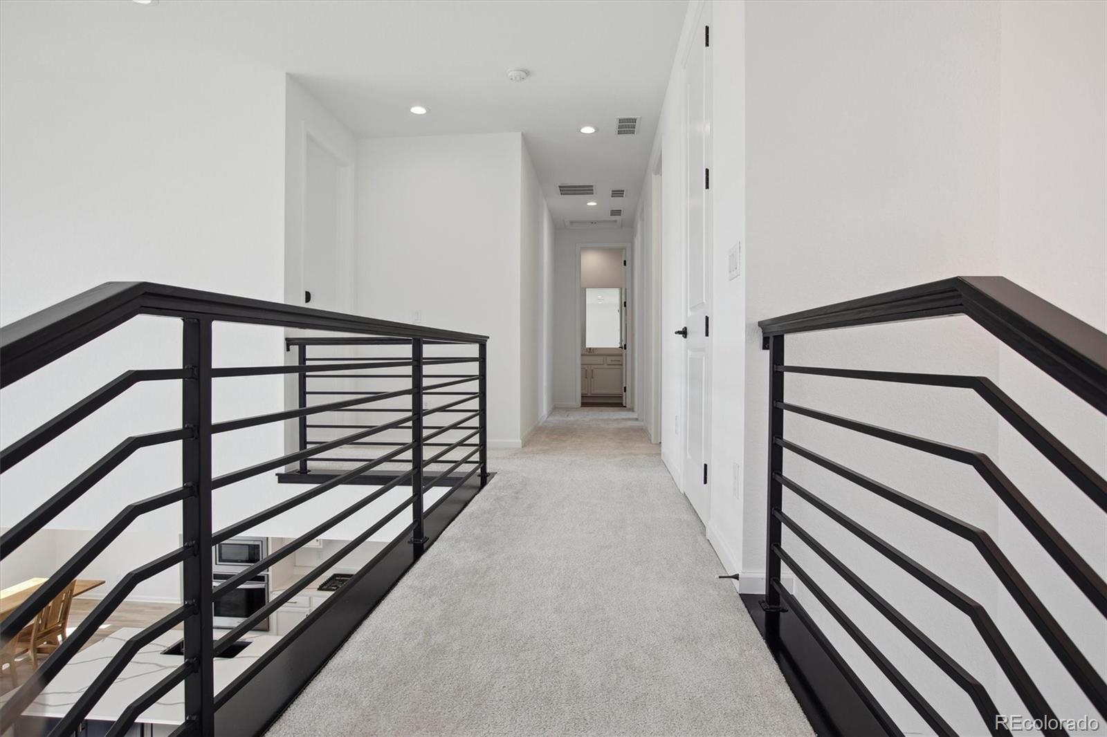 741 Simmental Loop Castle Rock, CO 80104 - Photo 20 of 50 a view of a hallway with staircase