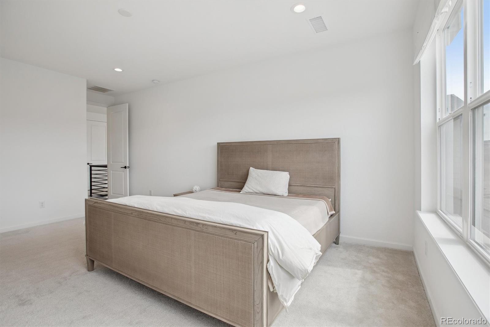 741 Simmental Loop Castle Rock, CO 80104 - Photo 23 of 50 a bed room with a bed and a window