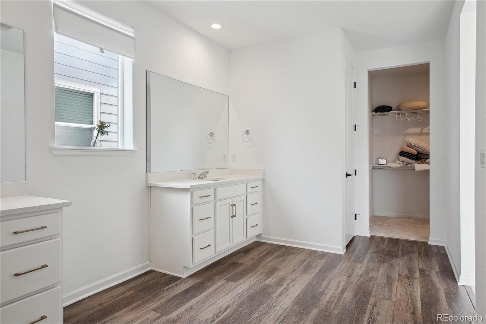 741 Simmental Loop Castle Rock, CO 80104 - Photo 28 of 50 a view of cabinets and wooden floor