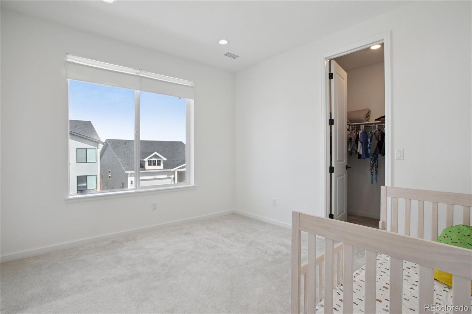 741 Simmental Loop Castle Rock, CO 80104 - Photo 31 of 50 a view of a small space with wooden floor and a window