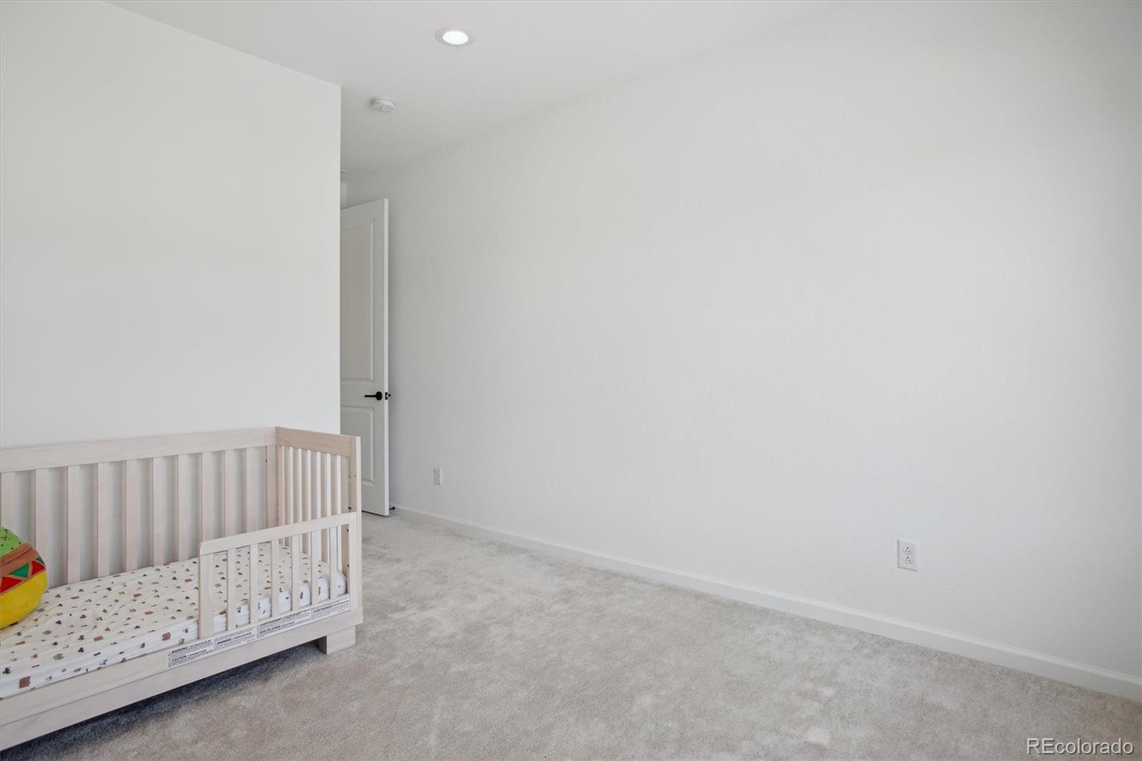 741 Simmental Loop Castle Rock, CO 80104 - Photo 32 of 50 a view of room with baby crib