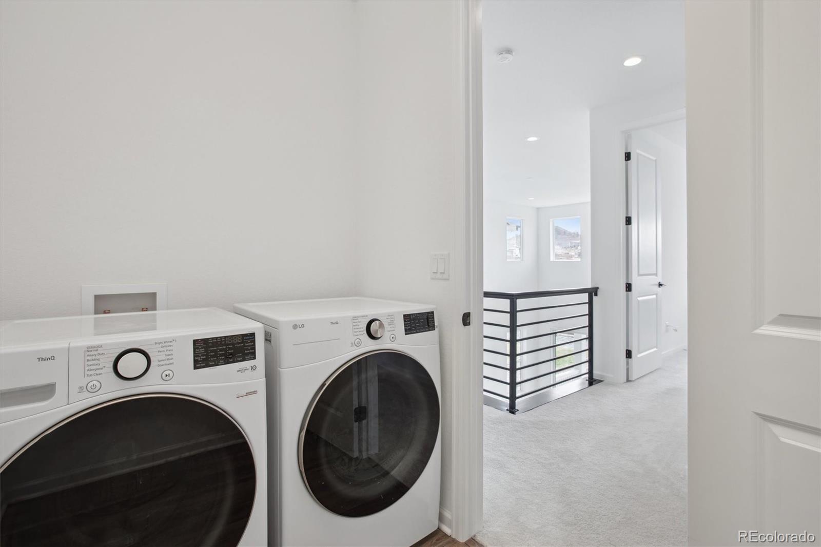 741 Simmental Loop Castle Rock, CO 80104 - Photo 36 of 50 a view of a storage & utility room with washer and dryer