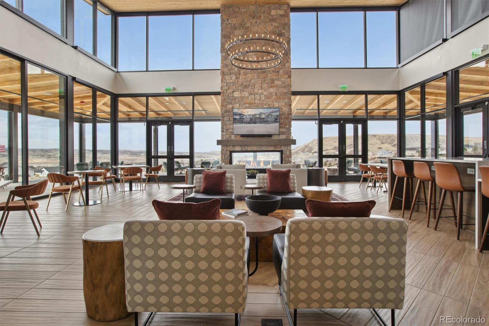 741 Simmental Loop Castle Rock, CO 80104 - Photo 46 of 50 a living room with fireplace furniture and a large window