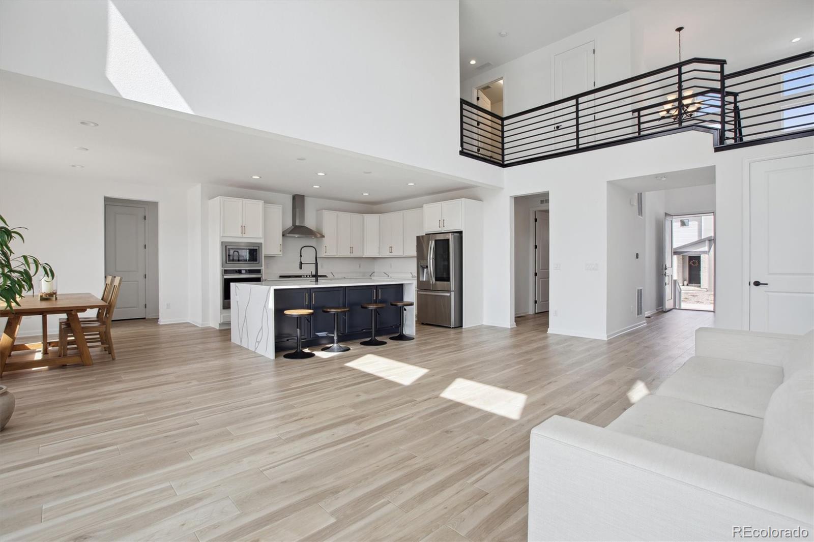 741 Simmental Loop Castle Rock, CO 80104 - Photo 7 of 50 a living room with furniture and kitchen view