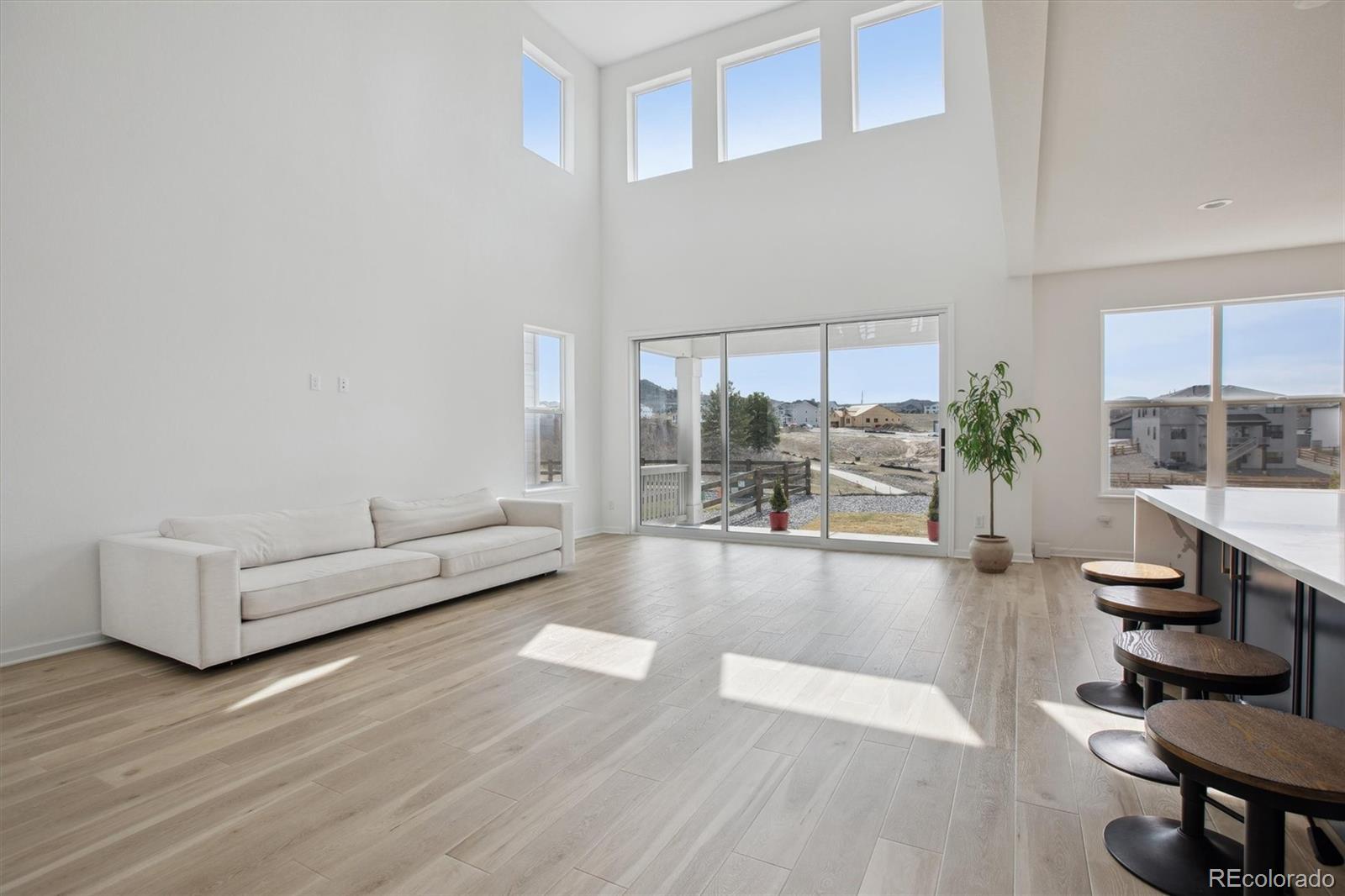 741 Simmental Loop Castle Rock, CO 80104 - Photo 8 of 50 a living room with furniture and a large window