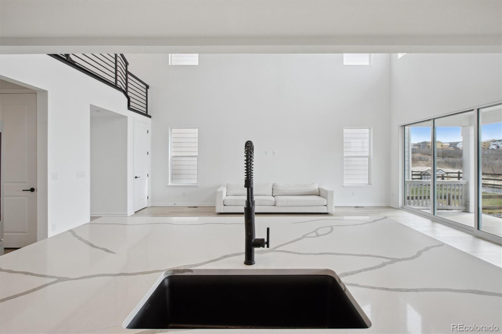 741 Simmental Loop Castle Rock, CO 80104 - Photo 10 of 50 a front view of a house with a large window