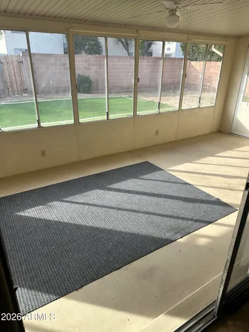 a view of an empty room with a window