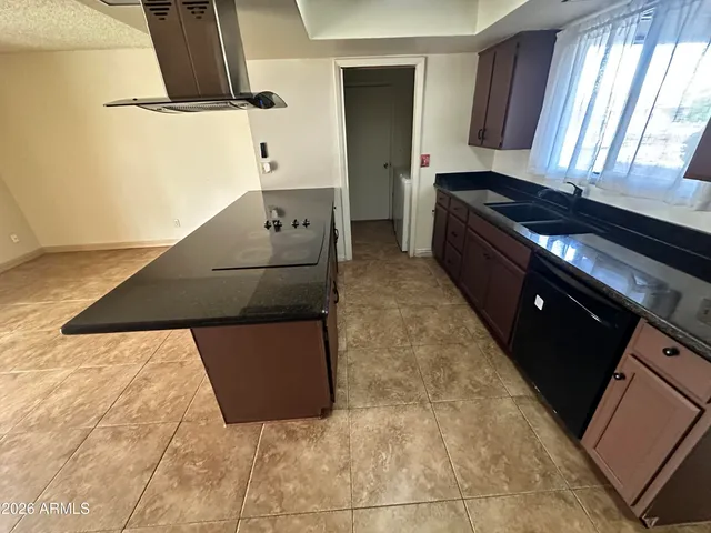 a kitchen with a stove and a refrigerator