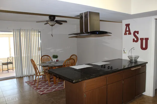 a kitchen with a table and a stove