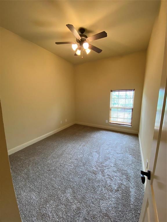 2222 Kirby Street Dallas, TX 75204 - Photo 8 of 25 Room with vaulted ceiling, plush carpet flooring, and a multi-blade ceiling fan with integrated lighting