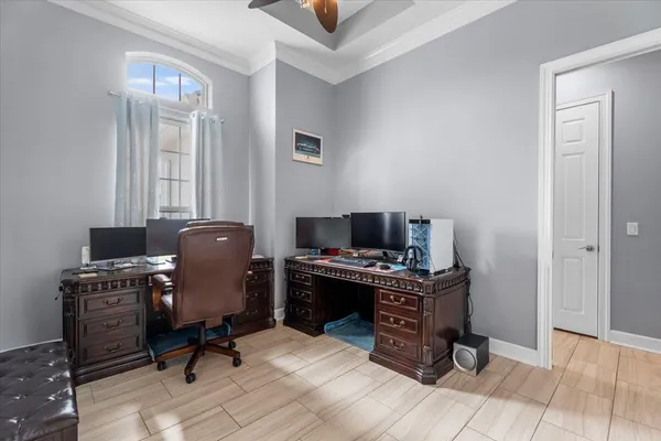 a living room with a large glass window and a glass door