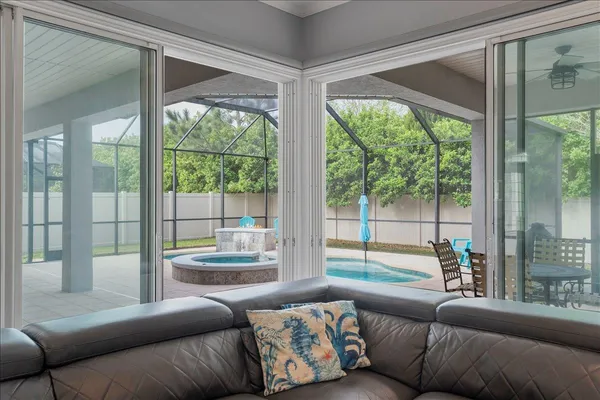 a living room with furniture kitchen view and a fireplace