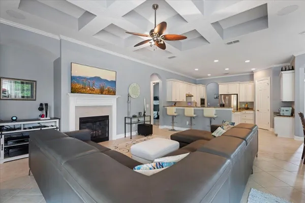 a kitchen with a sink and chairs