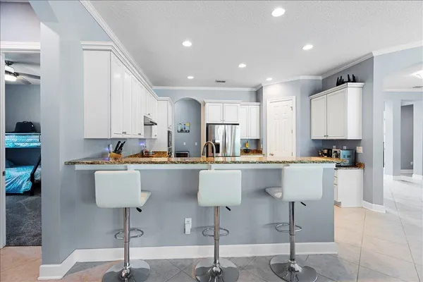 a kitchen with lots of counter top space and a sink