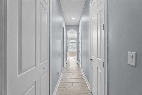 a bedroom with a bed and lamp