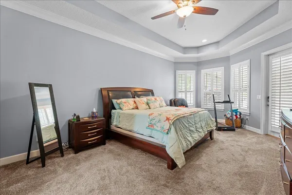 a spacious bathroom with a granite countertop sink a large mirror and bathtub
