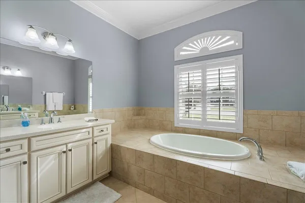 a utility room with sink dryer and washer
