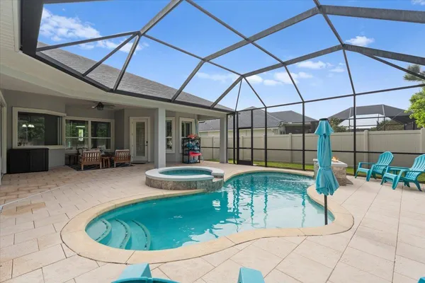 a view of a swimming pool with a patio