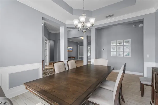 a workspace with wooden floor and furniture