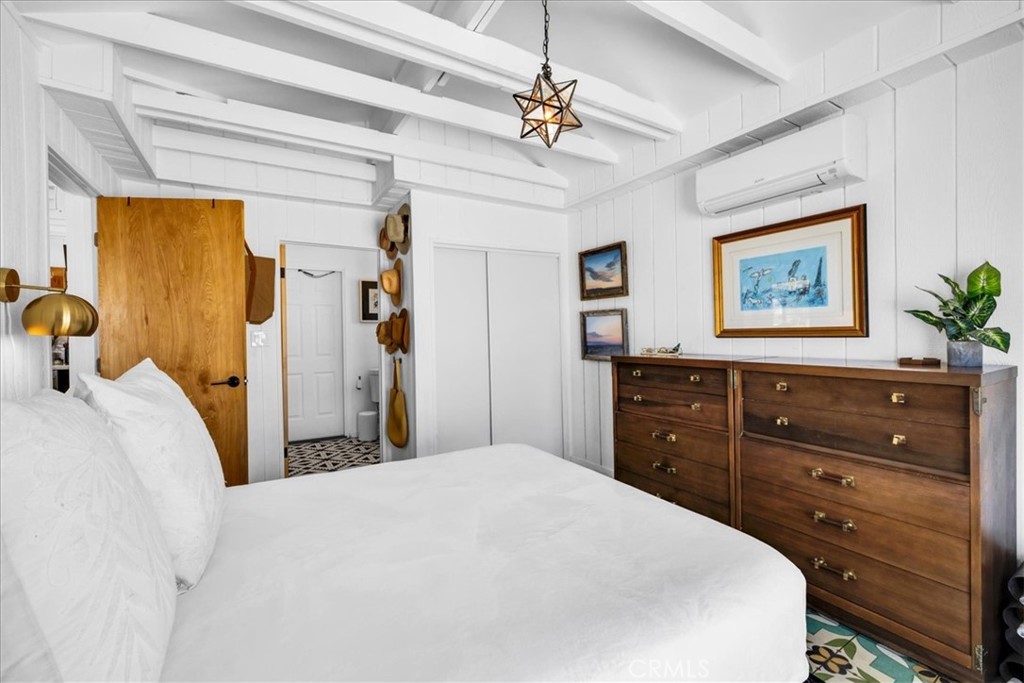 2837 Border Avenue Joshua Tree, CA 92252 - Photo 14 of 52 a bedroom with a bed and a dresser