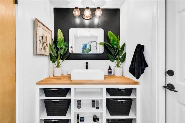 a table with chairs and potted plant on it
