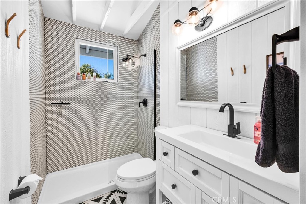 2837 Border Avenue Joshua Tree, CA 92252 - Photo 19 of 52 a bathroom with a sink a toilet and shower
