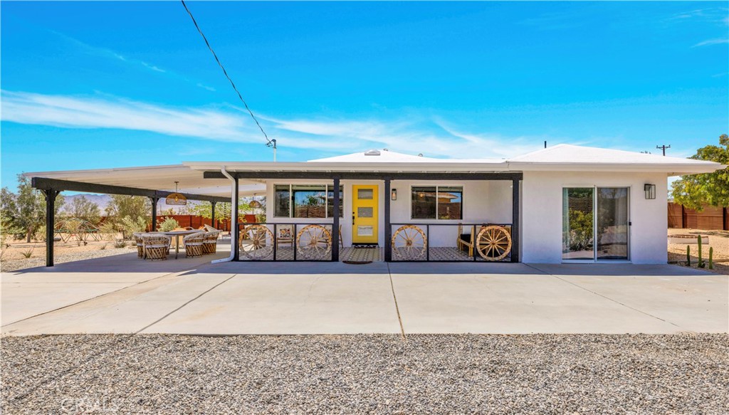2837 Border Avenue Joshua Tree, CA 92252 - Photo 2 of 52 a view of a house with sitting area and roof