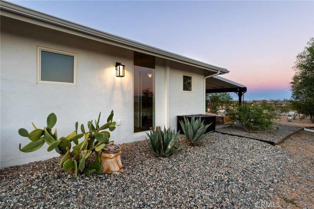 2837 Border Avenue Joshua Tree, CA 92252 - Photo 31 of 52 a front view of a house with a yard