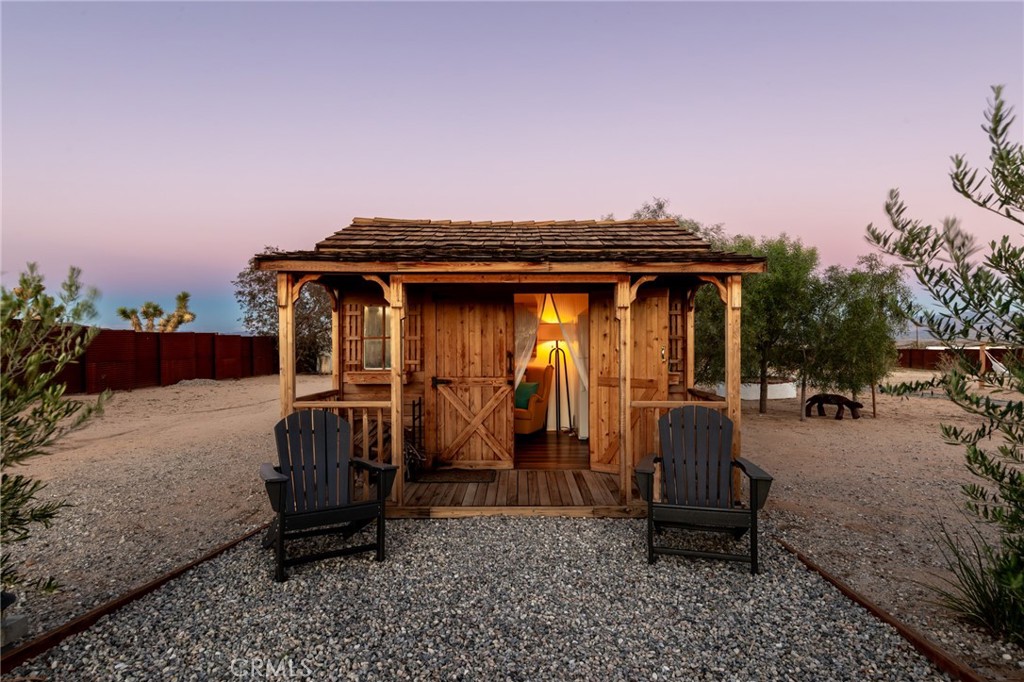 2837 Border Avenue Joshua Tree, CA 92252 - Photo 35 of 52 a front view of a house with sitting area