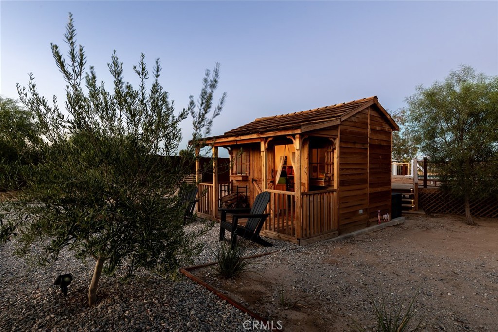 2837 Border Avenue Joshua Tree, CA 92252 - Photo 36 of 52 a front view of a house with garden