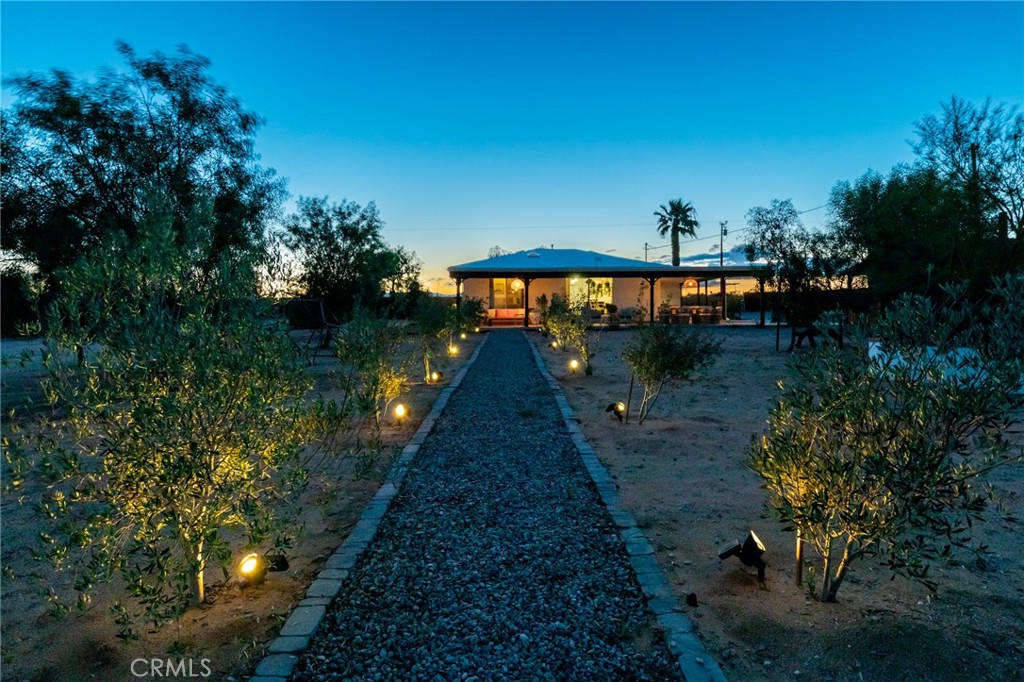 2837 Border Avenue Joshua Tree, CA 92252 - Photo 41 of 52 a backyard of a house with lots of green space