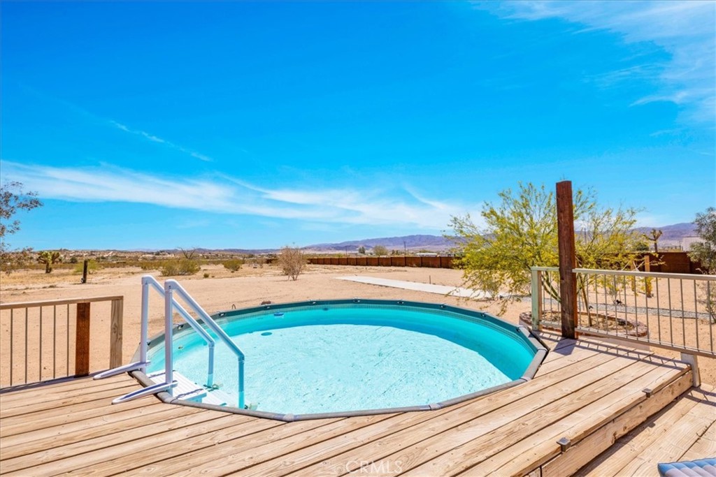 2837 Border Avenue Joshua Tree, CA 92252 - Photo 43 of 52 a view of a balcony with wooden floor and city view