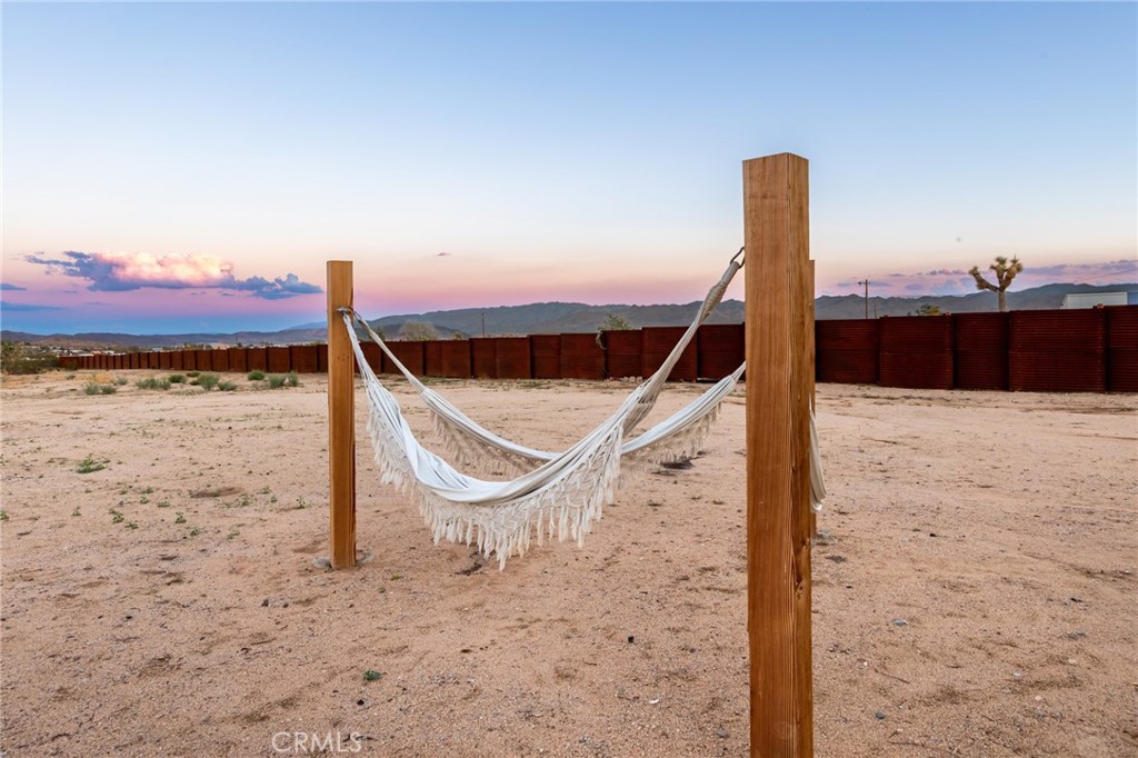 2837 Border Avenue Joshua Tree, CA 92252 - Photo 46 of 52 a view of a wooden deck in front of house