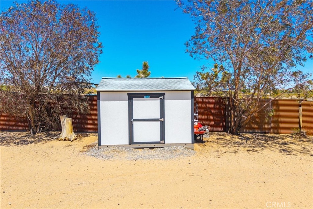 2837 Border Avenue Joshua Tree, CA 92252 - Photo 49 of 52 a view of wooden fence in front of a house