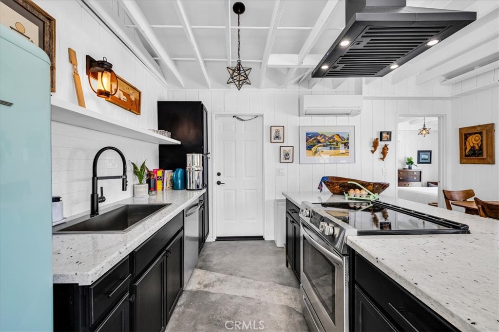 2837 Border Avenue Joshua Tree, CA 92252 - Photo 9 of 52 a kitchen that has a lot of cabinets in it
