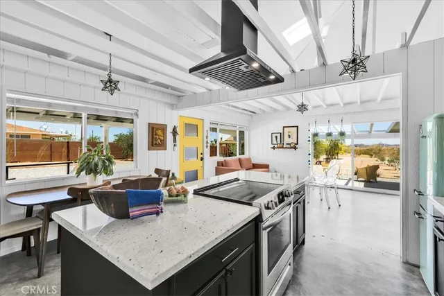 a kitchen with a stove and a refrigerator