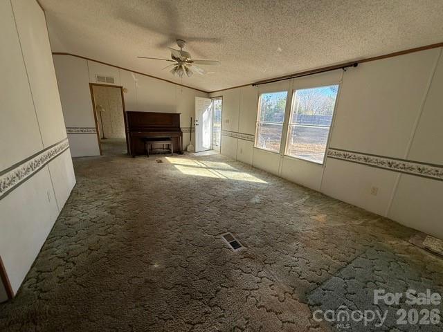 373 Griggs Road Clover, SC 29710 - Photo 14 of 41 a view of empty room with fireplace and windows