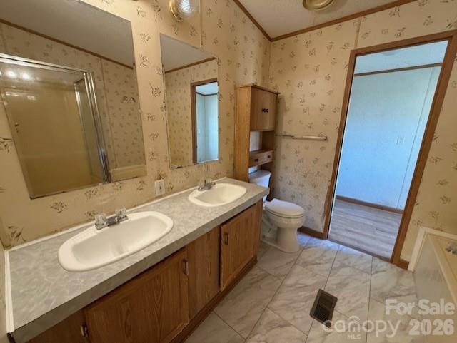 373 Griggs Road Clover, SC 29710 - Photo 37 of 41 a bathroom with a granite countertop sink a toilet a mirror and shower