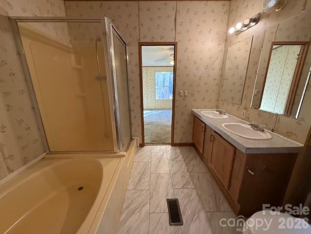 373 Griggs Road Clover, SC 29710 - Photo 38 of 41 a bathroom with a tub sink and mirror