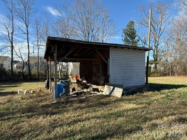 373 Griggs Road Clover, SC 29710 - Photo 6 of 41 a view of a wooden house with a yard