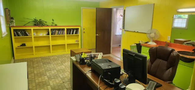 a bathroom with a sink mirror and tub