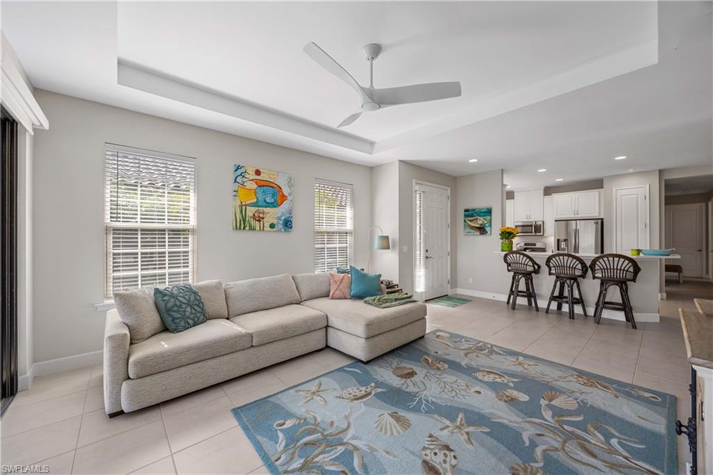 8110 Calle Canovas Street, Unit A Naples, FL 34114 - Photo 11 of 41 a living room with furniture and kitchen view