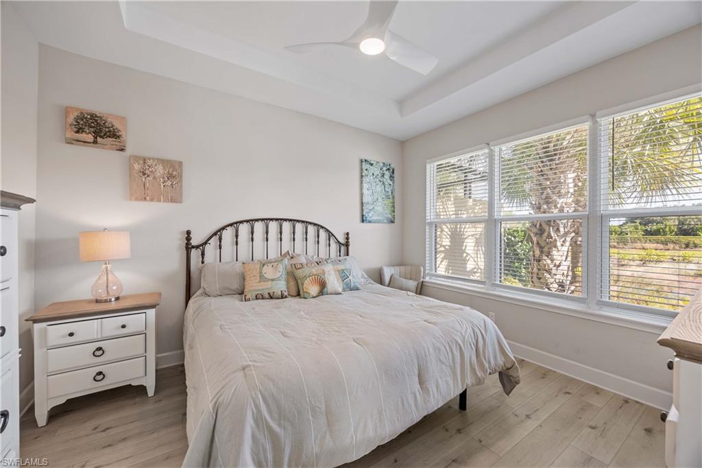 8110 Calle Canovas Street, Unit A Naples, FL 34114 - Photo 18 of 41 a bedroom with a large bed and a window